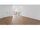 Spacious bonus room featuring wood floors and a staircase view to the second level at 509 Pearl St, Cumming, GA 30040