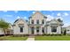 Two-story farmhouse with white siding, brick accents, and a landscaped lawn at 509 Pearl St, Cumming, GA 30040