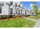 Charming two-story home displaying a well-maintained lawn and black trimmed windows at 509 Pearl St, Cumming, GA 30040