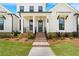 Charming home featuring a brick entry, manicured landscaping, and a welcoming front door at 509 Pearl St, Cumming, GA 30040