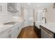 Modern kitchen with white cabinets, quartz countertops, and stainless steel appliances at 509 Pearl St, Cumming, GA 30040