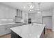 Modern kitchen with gray cabinetry, stainless steel appliances, and a bright, airy feel at 509 Pearl St, Cumming, GA 30040