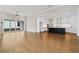 Open living room and kitchen area with hardwood floors and sliding doors to patio at 509 Pearl St, Cumming, GA 30040
