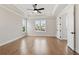 Bright main bedroom with hardwood floors and window view at 509 Pearl St, Cumming, GA 30040