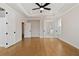 Spacious main bedroom with hardwood floors and ceiling fan at 509 Pearl St, Cumming, GA 30040