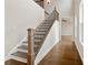 Elegant staircase with wood treads and black metal balusters at 509 Pearl St, Cumming, GA 30040