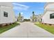 Exterior view of new homes on a street with green grass and a concrete driveway at 509 Pearl St, Cumming, GA 30040
