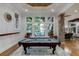 Enjoy this finished basement game room featuring a pool table and large windows at 879 Big Horn Hollow, Suwanee, GA 30024