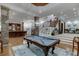 Large basement game room with a pool table and plenty of space for entertainment at 879 Big Horn Hollow, Suwanee, GA 30024
