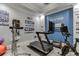 Home gym with treadmill, stationary bike, and inspirational wall art at 879 Big Horn Hollow, Suwanee, GA 30024