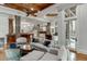 Spacious basement recreation room with comfortable seating and a large screen TV at 879 Big Horn Hollow, Suwanee, GA 30024
