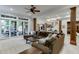 Open floor plan basement features a large sectional sofa and access to backyard at 879 Big Horn Hollow, Suwanee, GA 30024
