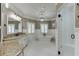 Spa-like bathroom with white subway tile, a large soaking tub, and separate shower at 879 Big Horn Hollow, Suwanee, GA 30024