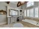 Spa-like bathroom featuring a soaking tub and dual vanities at 879 Big Horn Hollow, Suwanee, GA 30024