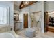 Elegant bathroom featuring a glass shower and a double sink vanity at 879 Big Horn Hollow, Suwanee, GA 30024