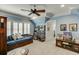 Charming bedroom with a daybed, built-in shelving, and window shutters at 879 Big Horn Hollow, Suwanee, GA 30024