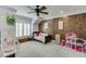 bedroom with wood accent wall, bunk bed, and ample closet space at 879 Big Horn Hollow, Suwanee, GA 30024