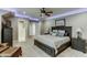 Main bedroom with gray color scheme, walk-in closet, and a dresser at 879 Big Horn Hollow, Suwanee, GA 30024