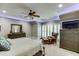 Main bedroom with a ceiling light, large windows, and seating area at 879 Big Horn Hollow, Suwanee, GA 30024