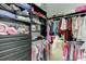 Walk-in closet with ample shelving and hanging space at 879 Big Horn Hollow, Suwanee, GA 30024