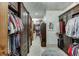 Spacious walk-in closet with custom shelving and ample storage at 879 Big Horn Hollow, Suwanee, GA 30024