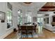 Bright dining area with a large square table and plenty of natural light at 879 Big Horn Hollow, Suwanee, GA 30024