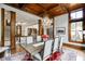 Formal dining room with wood ceiling, chandelier, and hardwood floors at 879 Big Horn Hollow, Suwanee, GA 30024