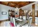 Bright dining room with hardwood floors, coffered ceiling and chandelier at 879 Big Horn Hollow, Suwanee, GA 30024