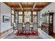 Elegant dining room with hardwood floors, a chandelier, and large windows at 879 Big Horn Hollow, Suwanee, GA 30024