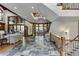Grand two-story entryway with tile floors and a staircase at 879 Big Horn Hollow, Suwanee, GA 30024