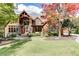 Brick home with stone accents, large windows, and a three-car garage at 879 Big Horn Hollow, Suwanee, GA 30024