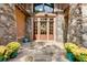 Elegant entryway with double doors and stone accents at 879 Big Horn Hollow, Suwanee, GA 30024