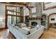 Relaxing Gathering room with stone fireplace and large sectional sofa at 879 Big Horn Hollow, Suwanee, GA 30024