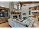 Open floor plan Gathering room with stone fireplace and built-ins at 879 Big Horn Hollow, Suwanee, GA 30024