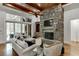 Spacious Gathering room with stone fireplace and built-in shelving at 879 Big Horn Hollow, Suwanee, GA 30024