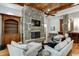 Comfortable Gathering room with stone fireplace and hardwood floors at 879 Big Horn Hollow, Suwanee, GA 30024