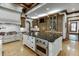 Gourmet kitchen features island, custom cabinetry, and high-end appliances at 879 Big Horn Hollow, Suwanee, GA 30024