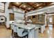 Large kitchen with granite island, breakfast bar, and custom cabinetry at 879 Big Horn Hollow, Suwanee, GA 30024