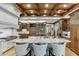 Gourmet kitchen features a large island with seating and high-end appliances at 879 Big Horn Hollow, Suwanee, GA 30024