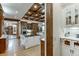 Spacious kitchen with island, wooden beams, and butler's pantry at 879 Big Horn Hollow, Suwanee, GA 30024