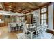 Open kitchen and dining area with hardwood floors, a large island, and custom cabinetry at 879 Big Horn Hollow, Suwanee, GA 30024