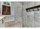 Bright laundry room with built-in storage, window seat, and modern cabinetry at 879 Big Horn Hollow, Suwanee, GA 30024