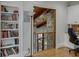 Built-in bookcase and view to a second story overlook at 879 Big Horn Hollow, Suwanee, GA 30024