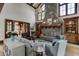 Spacious living room with a stone fireplace and built-in shelving at 879 Big Horn Hollow, Suwanee, GA 30024