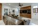 Spacious living room with a large sectional sofa and built-in entertainment center at 879 Big Horn Hollow, Suwanee, GA 30024