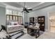 Main bedroom suite with king bed, office space, and access to en-suite bathroom at 879 Big Horn Hollow, Suwanee, GA 30024