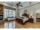 Luxurious main bedroom with hardwood floors and a sitting area at 879 Big Horn Hollow, Suwanee, GA 30024