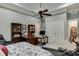 Main bedroom with king bed, built-in office space and workout area at 879 Big Horn Hollow, Suwanee, GA 30024