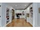 Bright home office with built-in shelving and hardwood floors at 879 Big Horn Hollow, Suwanee, GA 30024