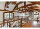 Spacious open loft with exposed wooden beams and hardwood floors at 879 Big Horn Hollow, Suwanee, GA 30024